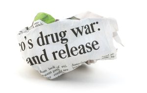 Newspaper frustration concept about the drug war.